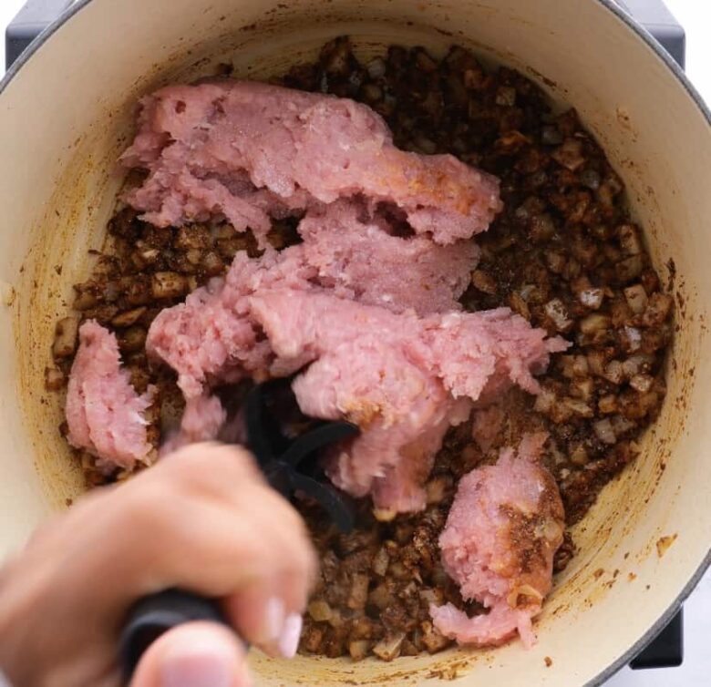 ground turkey cooking in pot.