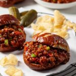 instant pot sloppy joes served on buns with sides.