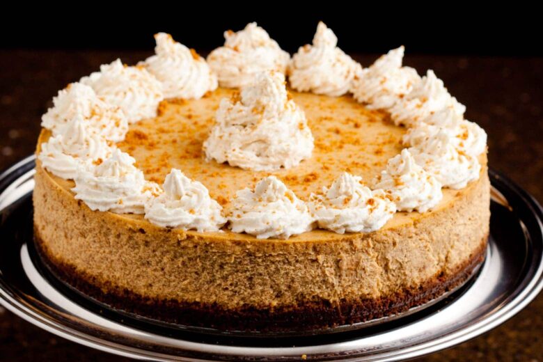 Whole Pumpkin Cheesecake on a Cake Stand.