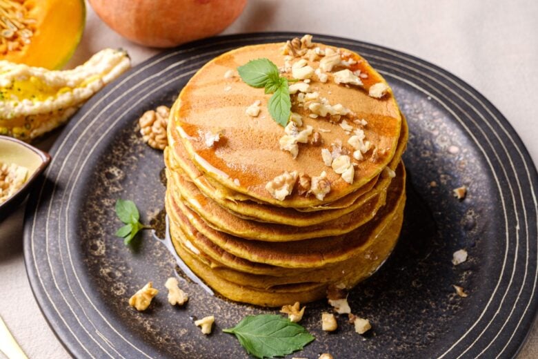 pumpkin pancakes plated and garnished.
