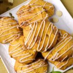 pumpkin spice cookies with glaze on a plate.