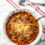 pumpkin chili with cheese in a bowl.