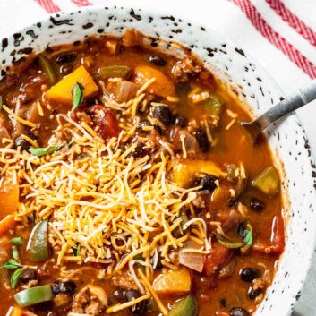 pumpkin chili with cheese in a bowl.
