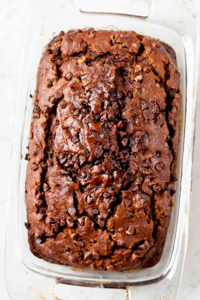 pumpkin chocolate chip bread loaf in a baking pan.