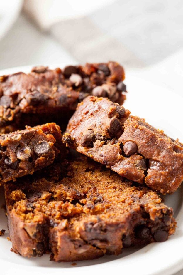 pumpkin chocolate chip bread sliced on plate.