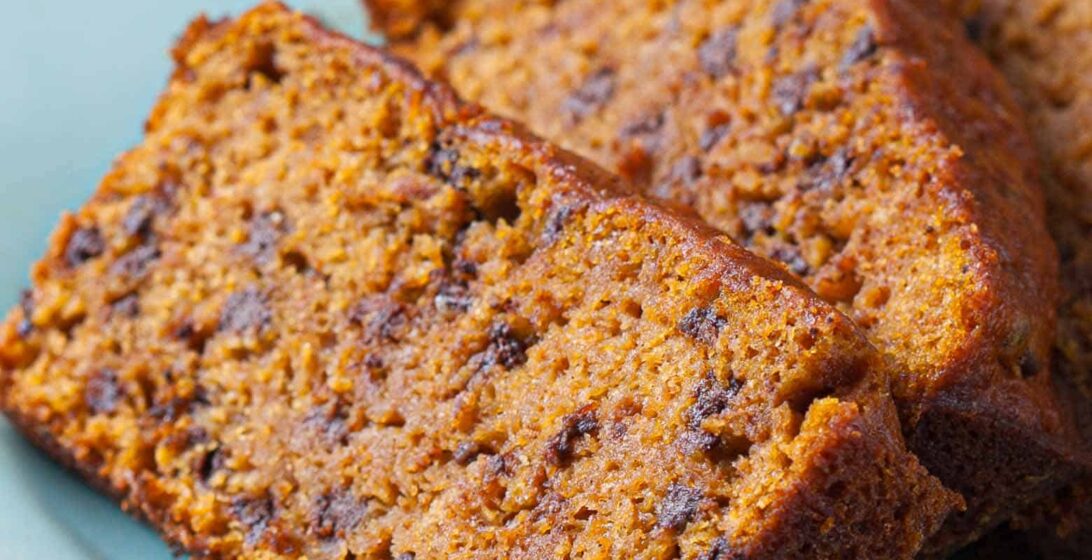 vegan pumpkin bread slices on a plate.