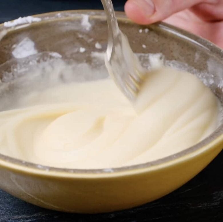 almond bars custard ingredients mixed in a bowl.
