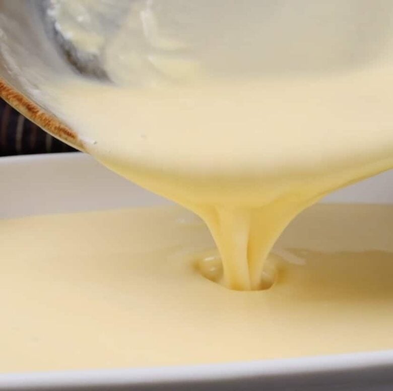 almond bars filling poured into pan.