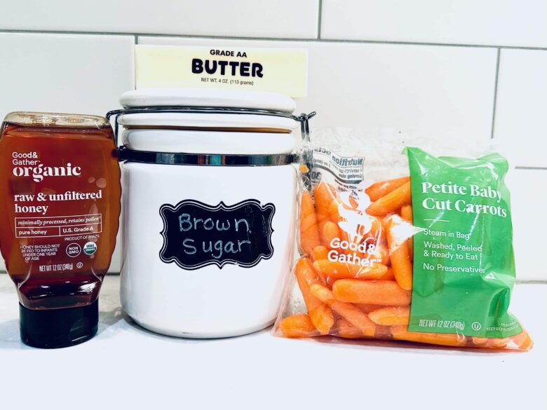 Honey glazed carrot ingredients on a kitchen counter.