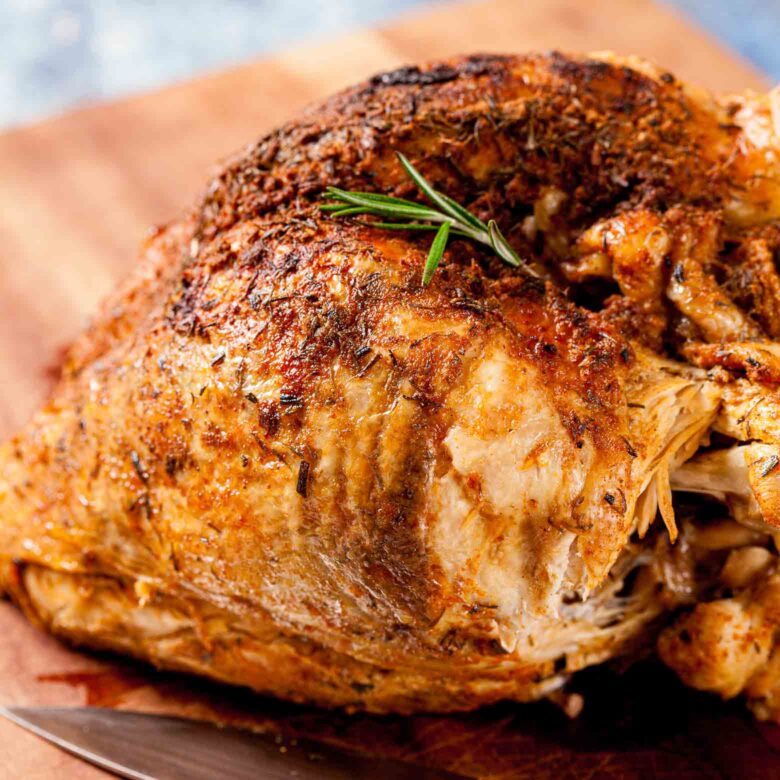 instant pot turkey breast resting on cutting board.