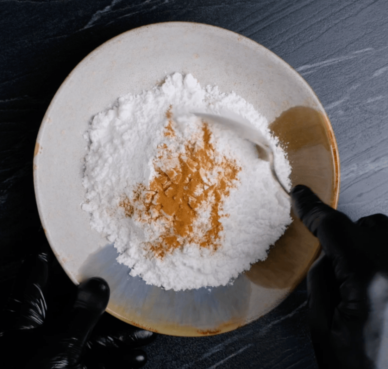 snowball cookies powdered sugar and cinnamon mixed.