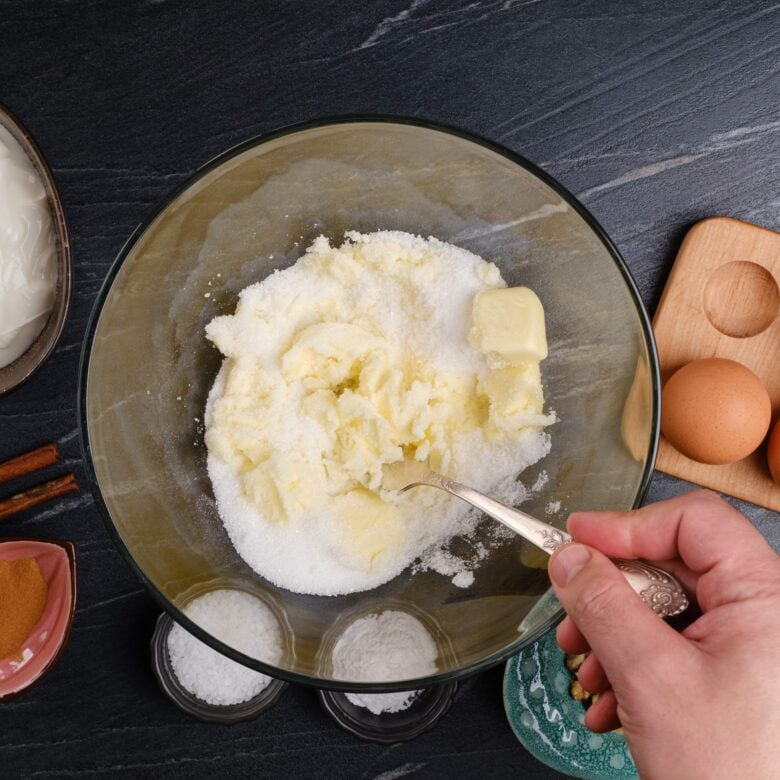 sour cream coffee cake butter and sugar being mixed.