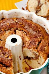 sour cream coffee cake sliced in Bundt pan.
