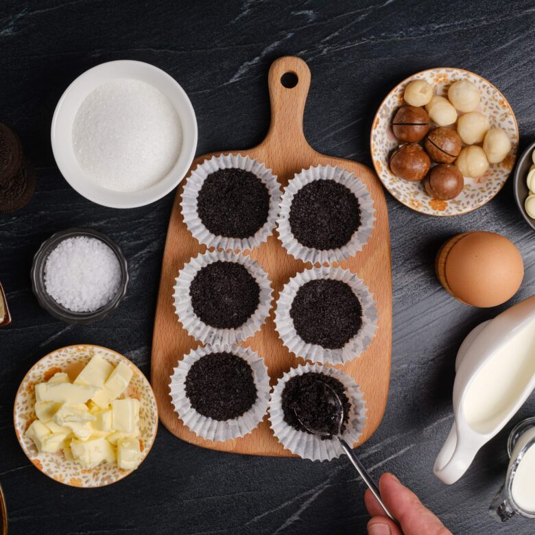 salted caramel cheesecake bites crust pressed into muffin tins.
