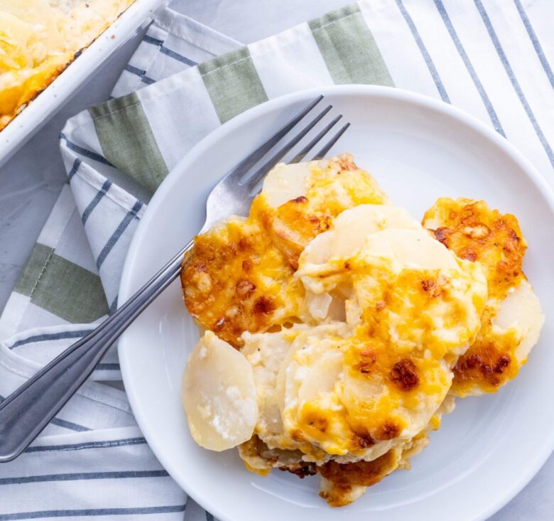 cheesy scalloped potatoes on a plate.