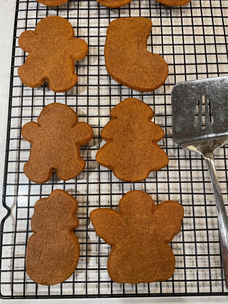 gingerbread cookies cut out on rack.