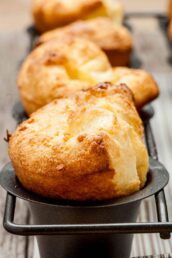 Closeup shot of popovers in popover pans.