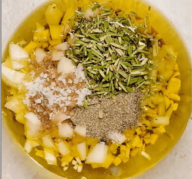 A small mixing bowl with sheet pan pork tenderloin marinade ingredients.