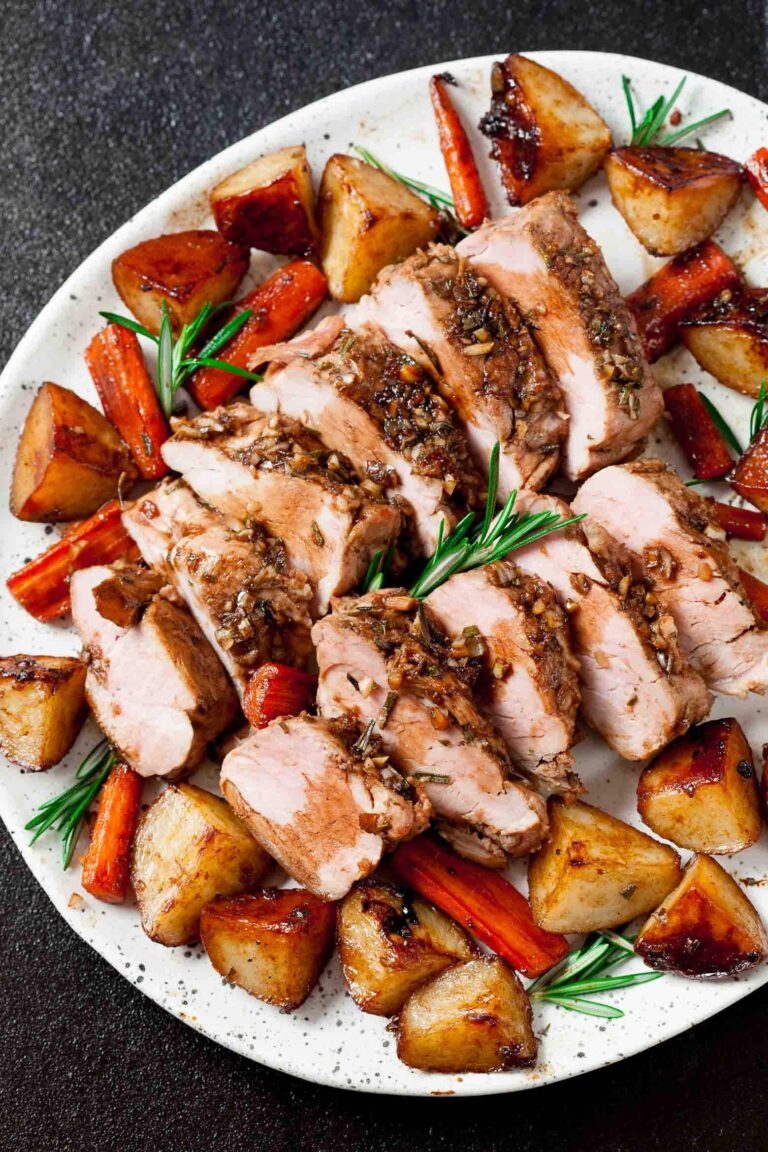 Sheet pan pork tenderloin served on a plate.