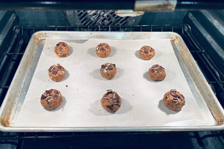 Andes mint cookies in oven on baking sheet.