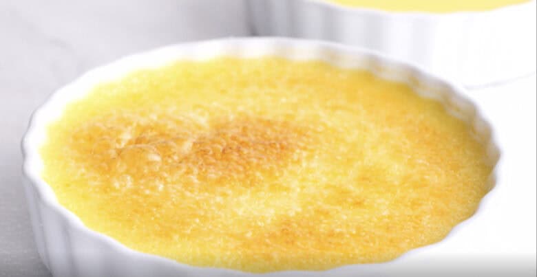 Creme brulee sugar topping being caramelized.