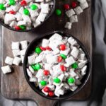 Two bowls with muddy buddies ready to serve.