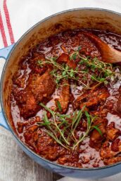 tender stovetop pork ragu in a pot.