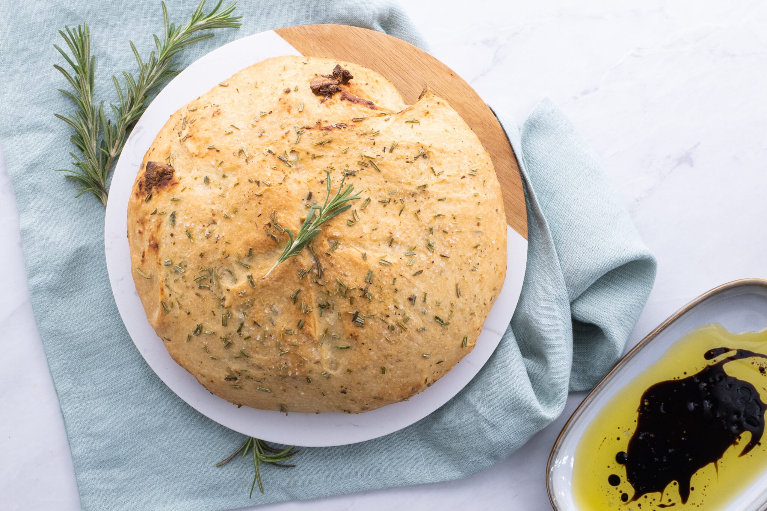 Rustic Rosemary Garlic Bread served with olive oil and balsamic vinegar.