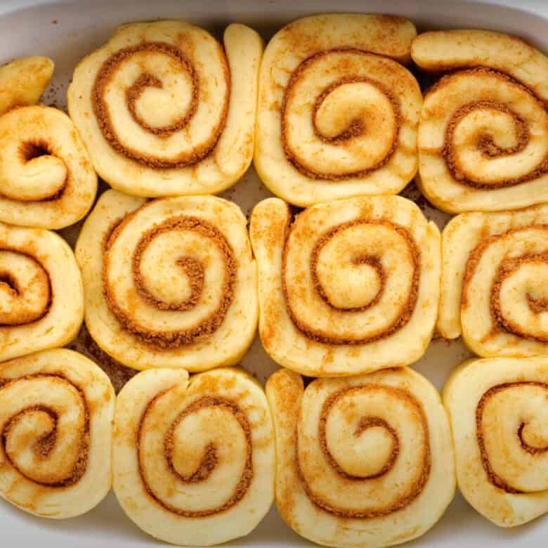 Unbaked cinnamon rolls doubled in size after rising.