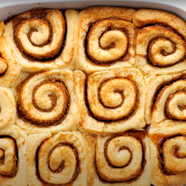 Freshly baked cinnamon rolls still in the baking dish.