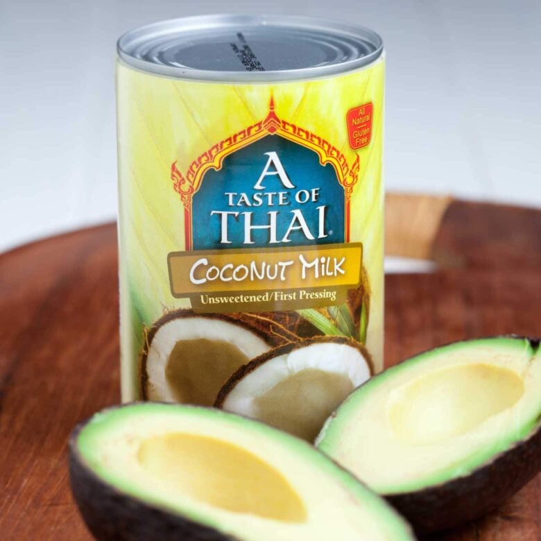 A can of unsweetened A Taste of Thailand coconut milk and avocados.