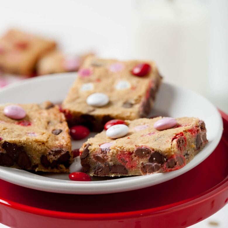 finished blondies cookie bars with chocolate chips on a plate.