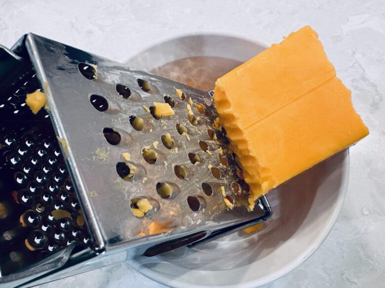 fresh cheese being grated. 