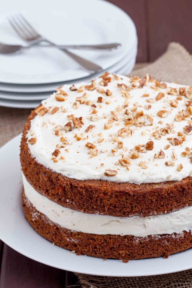 Carrot Cake With Cream Cheese Frosting with plates and fork.