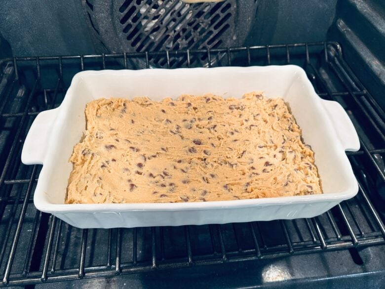 chocolate chip cookie bar batter in pan.