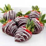 chocolate covered strawberries on a plate.