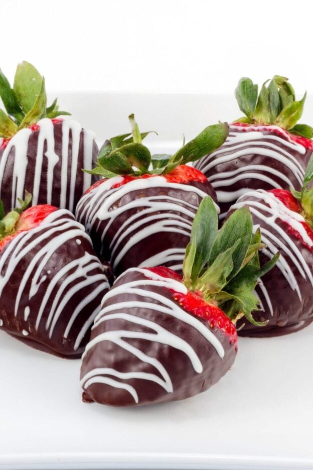 chocolate covered strawberries on a plate.
