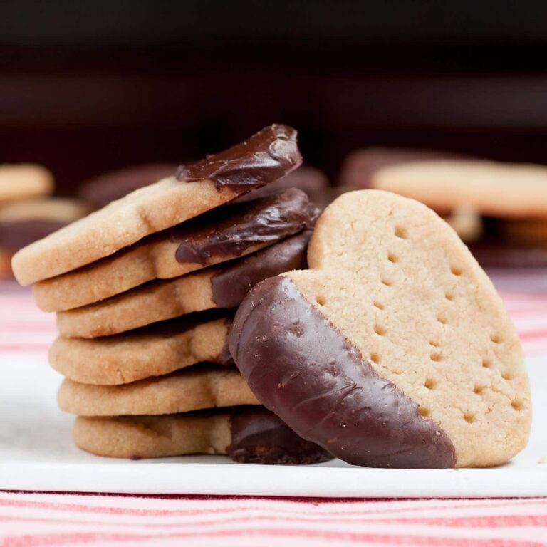 chocolate dipped shortbread cookies stacked.