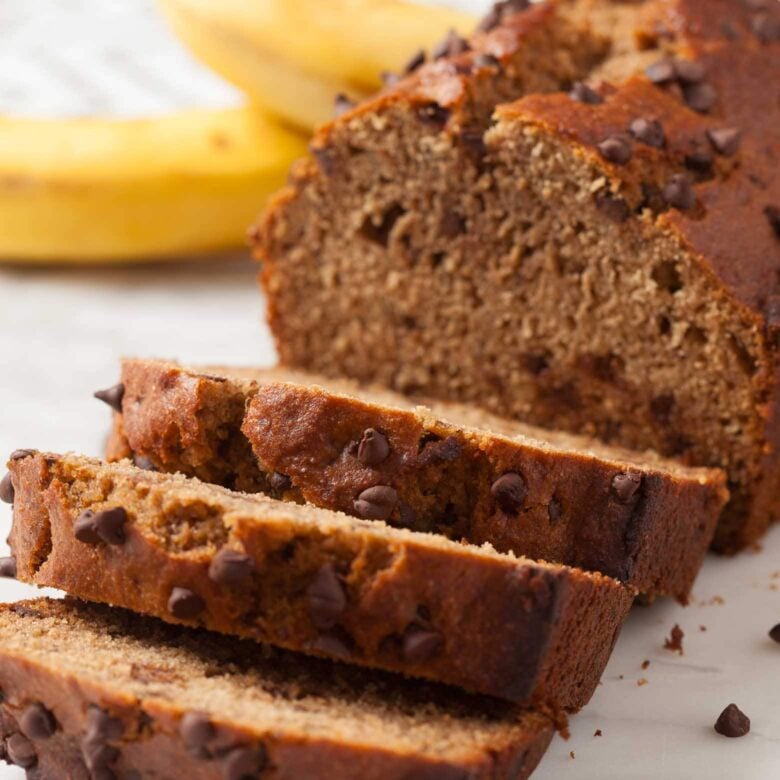 Sliced dairy-free banana bread with chocolate chips.