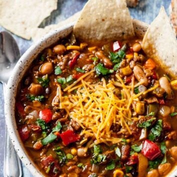 garnished vegetarian chili in a bowl.