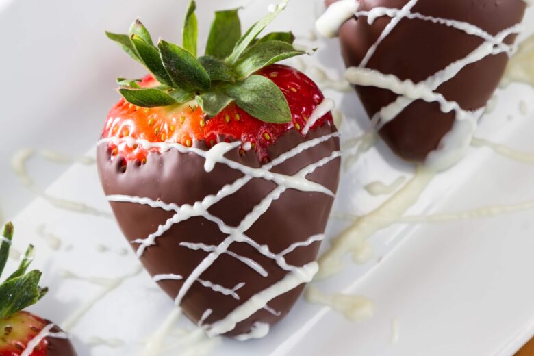 white chocolate drizzled over strawberries.