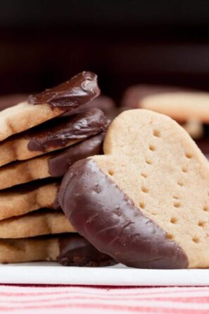 chocolate dipped shortbread cookies stacked.