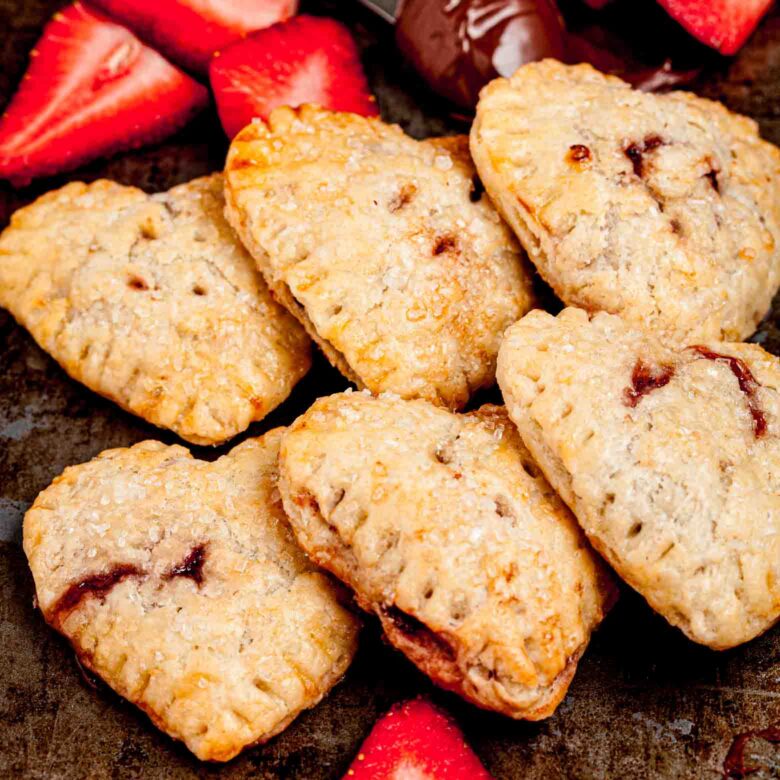 strawberry Nutella hand pies with fresh strawberries.