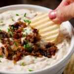 caramelized onion dip in a bowl with chips