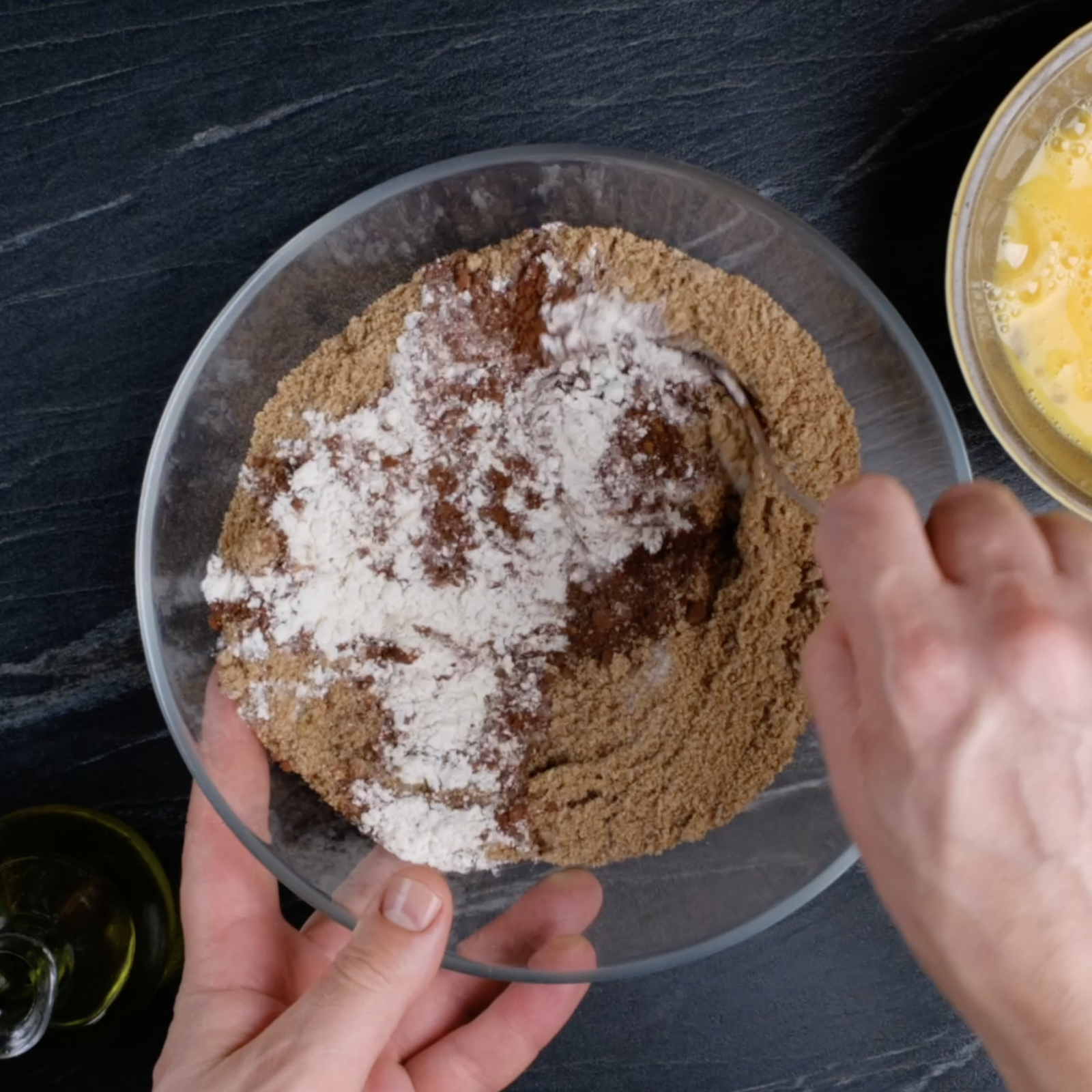 Dry ingredients in a bowl for healthy chocolate cake.