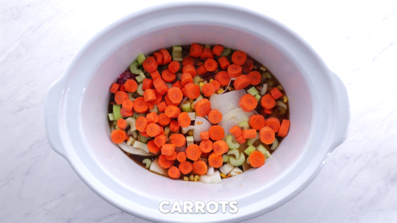 beef and barley stew veggies added to slow-cooker.