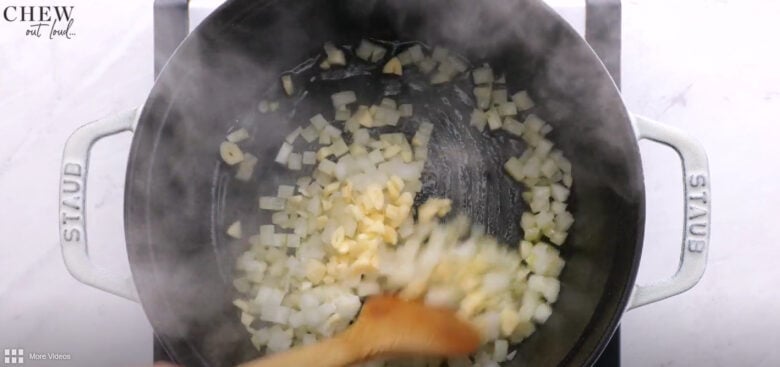 vegetarian chili onions and garlic cooking in pot.