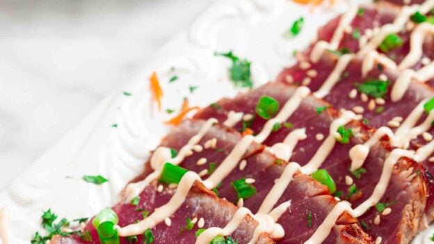 seared ahi tuna plated and garnished.