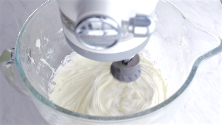 easy carrot cake cream cheese frosting being mixed.
