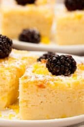 lemon custard cake plated and garnished close up.